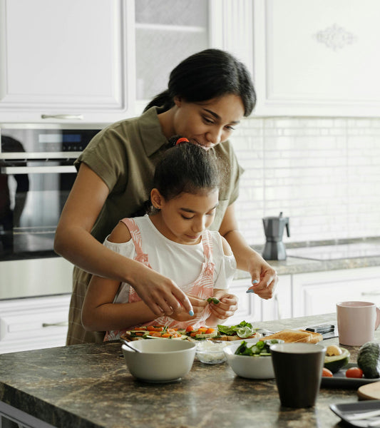 a mother and daughter in the kitchen