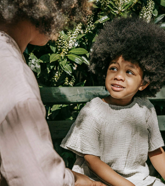 a black mother and child talking